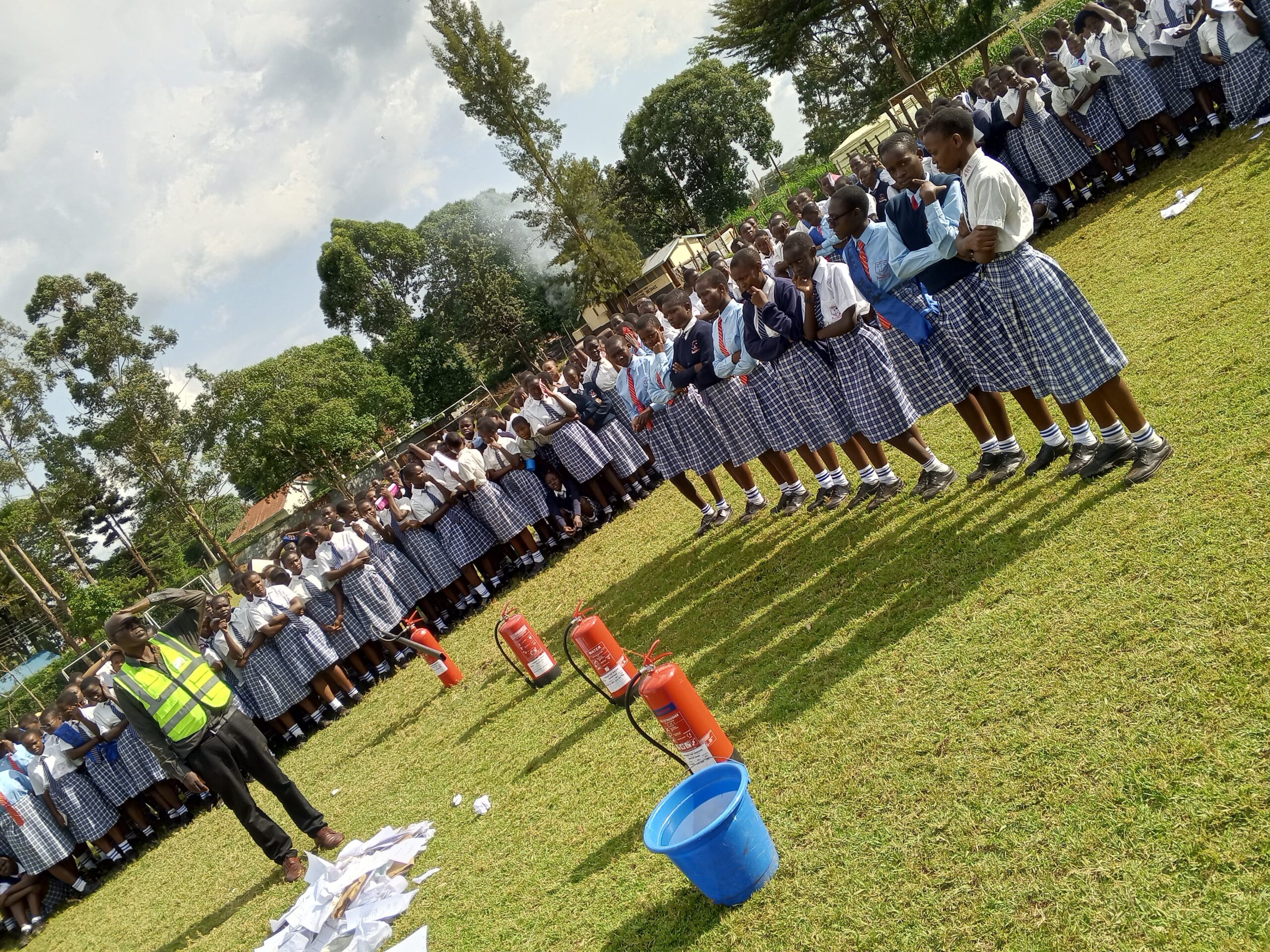 Lindum Systems technician unloading fire extinguishers during safety training setup in Kenya

